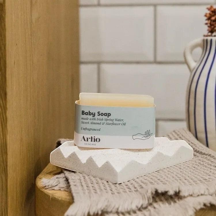 Precious Days Gifts Artio natural unfragranced baby soap bar on a white textured soap dish