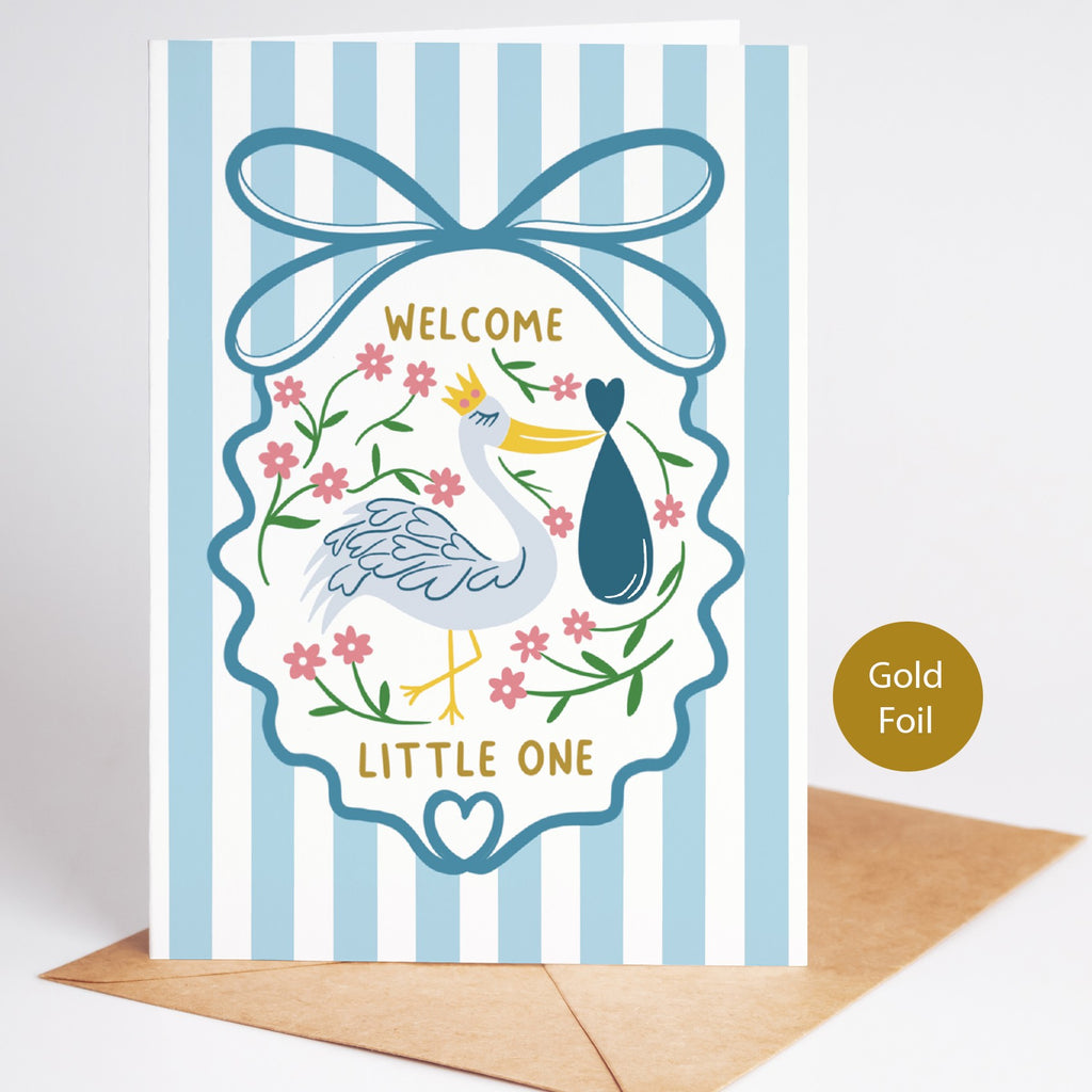 Precious Days Gifts blue striped baby card with stork, floral details, gold lettering "Welcome Little One", and gold foil accent.