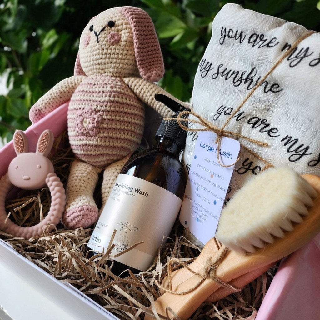Precious Days Gifts new baby gift box with a crochet bunny, muslin, teether, wash, and brush set.