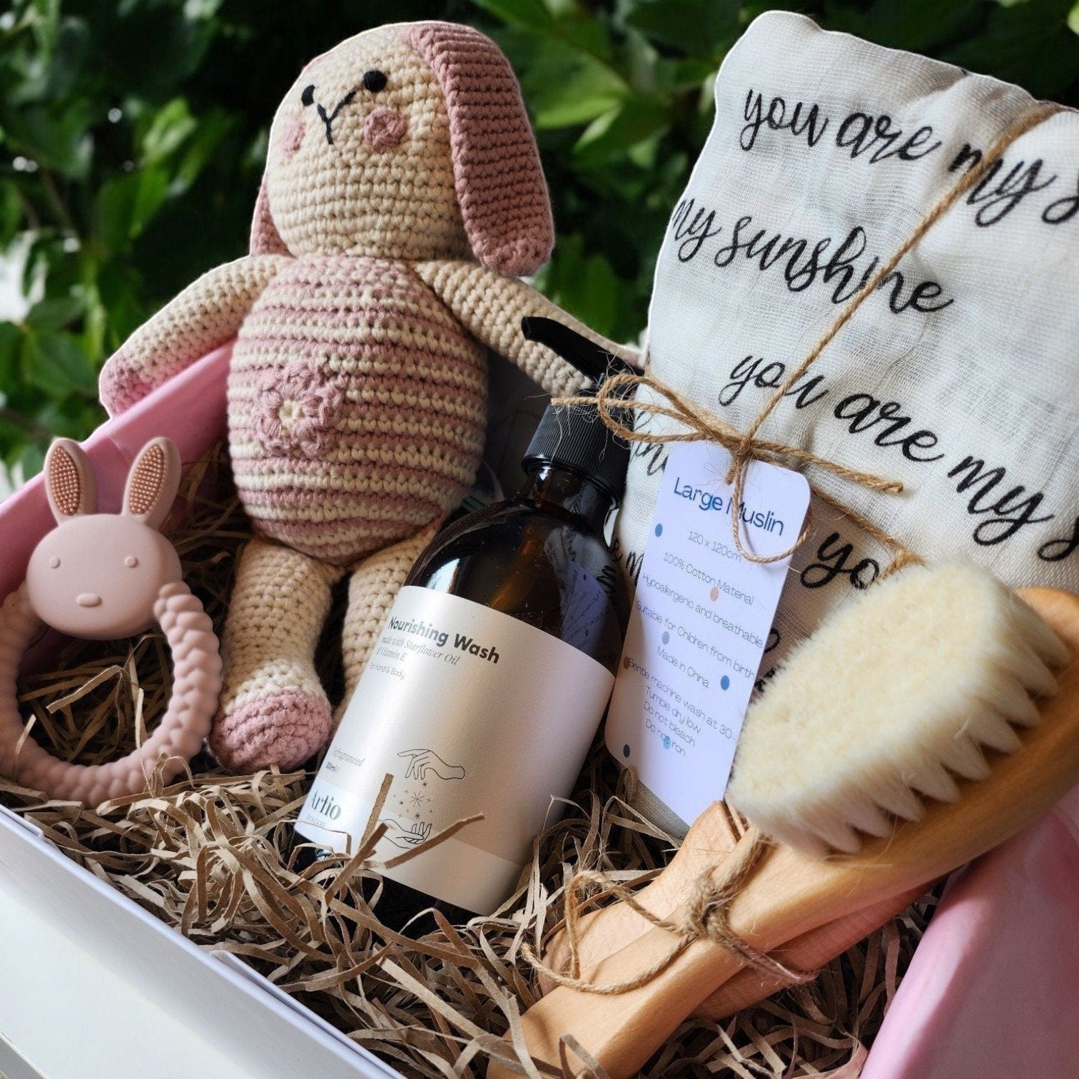 Precious Days Gifts new baby gift box with a crochet bunny, muslin, teether, wash, and brush set.