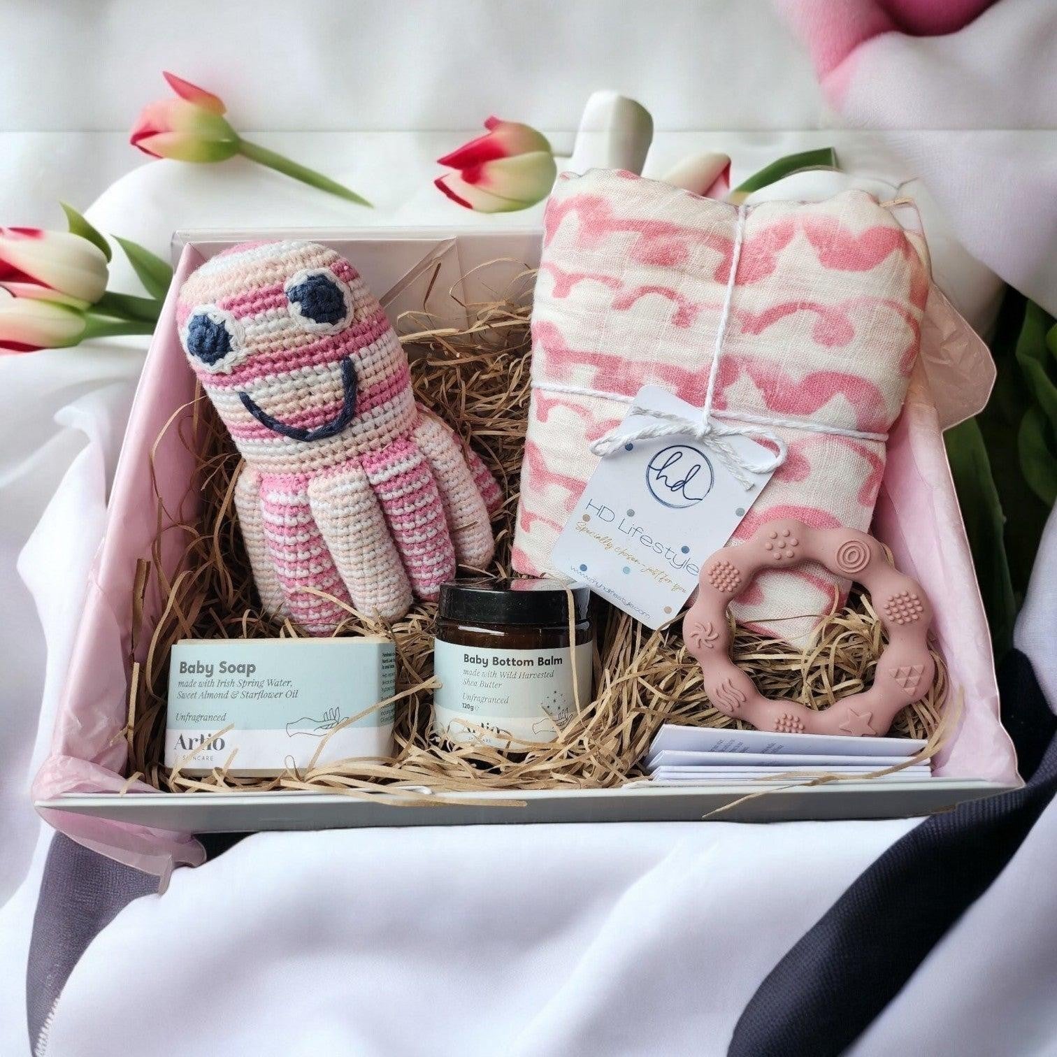 Precious Days Gifts new baby gift box with pink waves muslin, octopus rattle, teether, baby soap and balm.