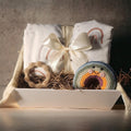 Precious Days Gifts Sweet Dreams gift box with a large minky dot fleece blanket, teether, and crochet rainbow rattle.