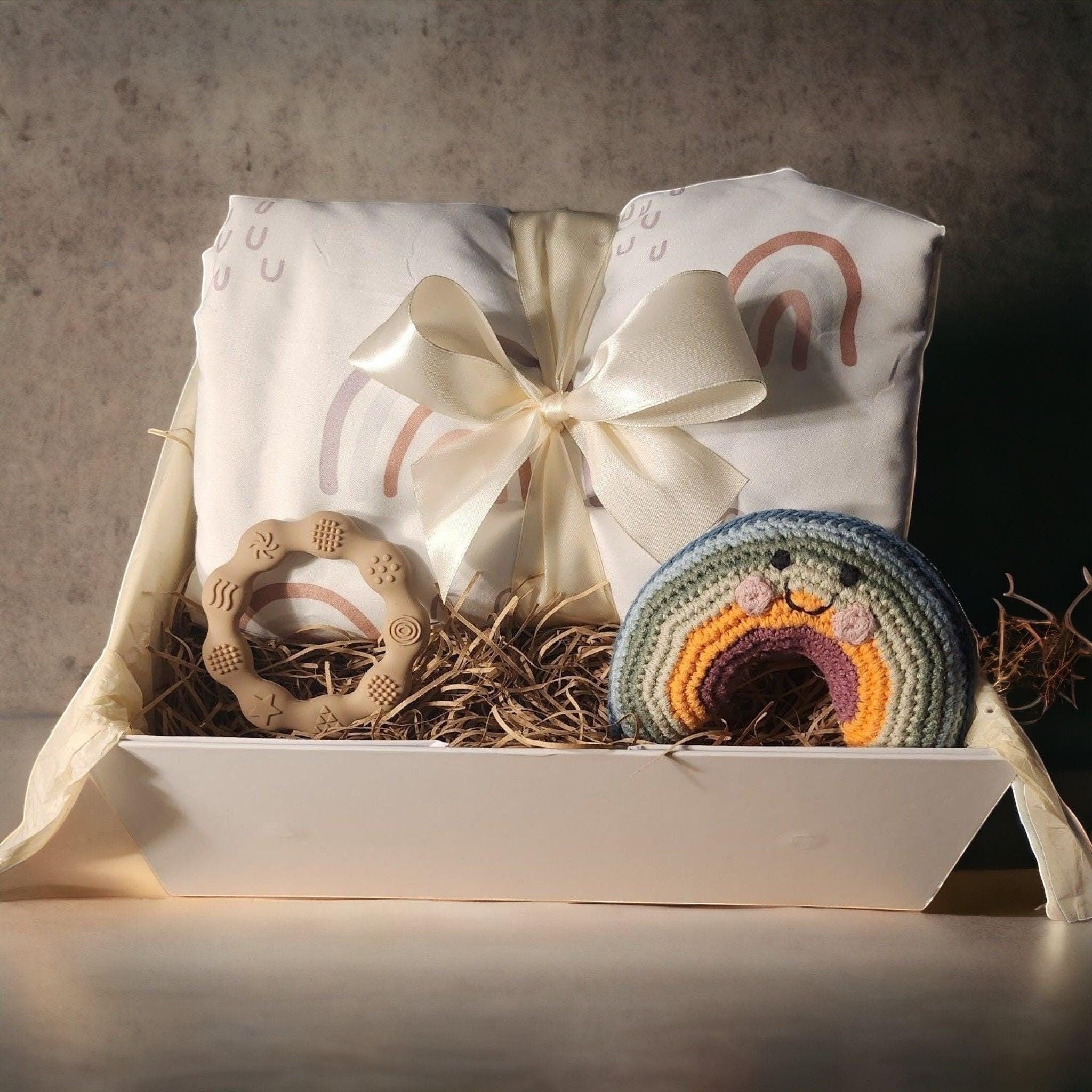 Precious Days Gifts Sweet Dreams gift box with a large minky dot fleece blanket, teether, and crochet rainbow rattle.