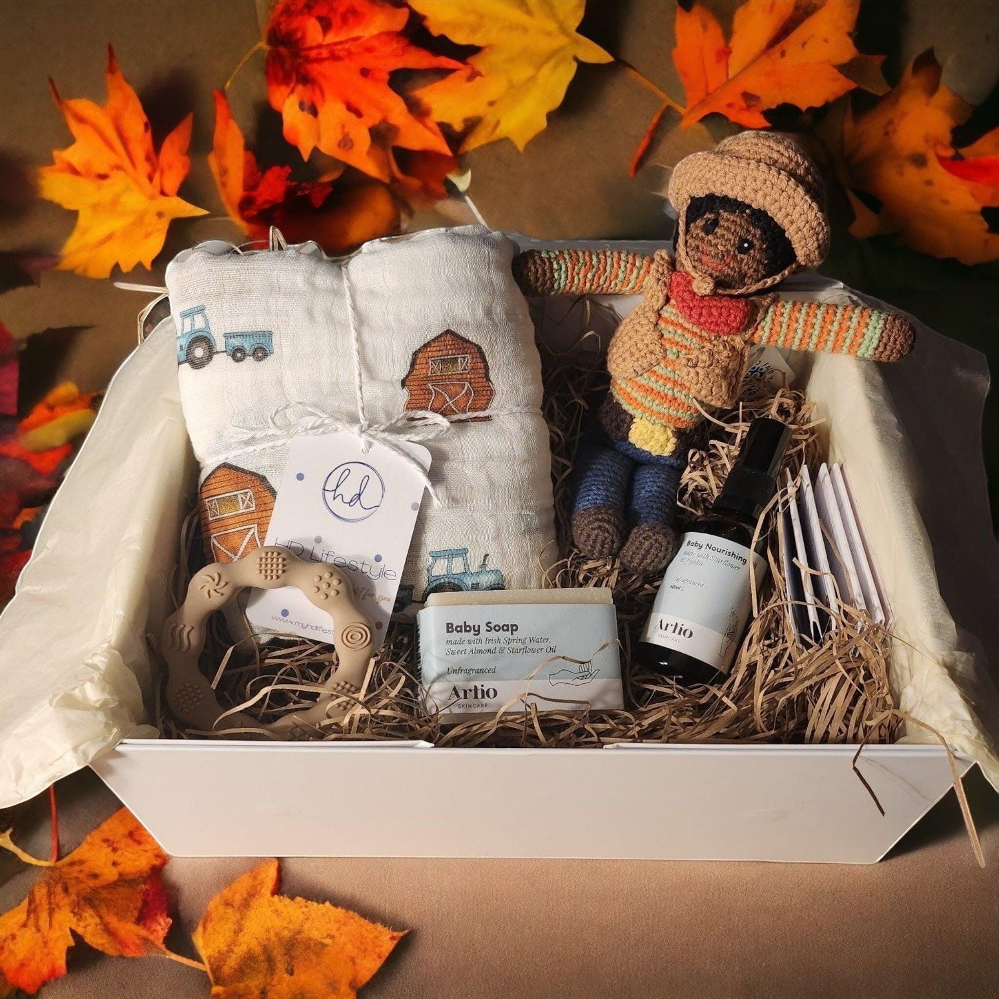 Precious Days Gifts Yeeha! baby gift box with cotton muslin, cowboy rattle, teether, soap, and oil.