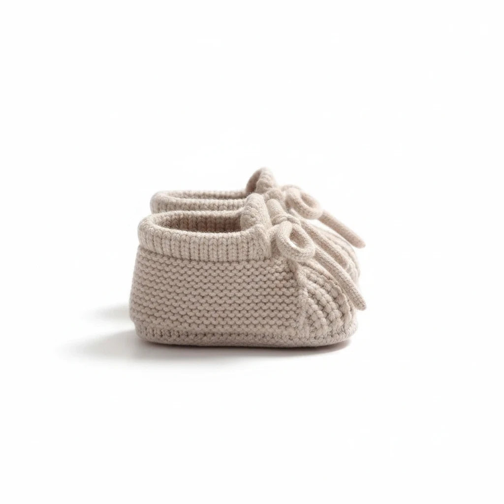 Precious Days Gifts beige knitted baby booties with a decorative front bow and soft cable-knit texture