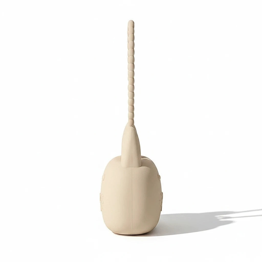 Precious Days Gifts beige silicone bunny storage pouch with a textured wrist strap, side view on white background.