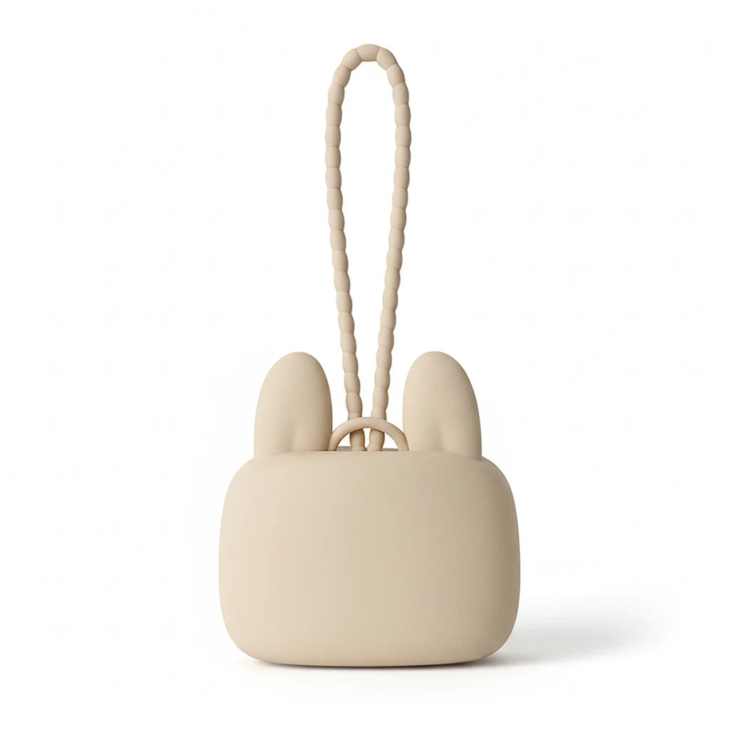 Precious Days Gifts beige silicone bunny storage pouch with a textured wrist strap for carrying small essentials.