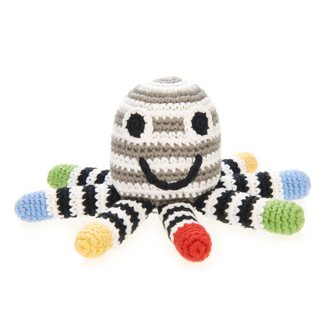 Precious Days Gifts handcrafted crochet octopus rattle with black, white, and colorful striped tentacles for newborns.