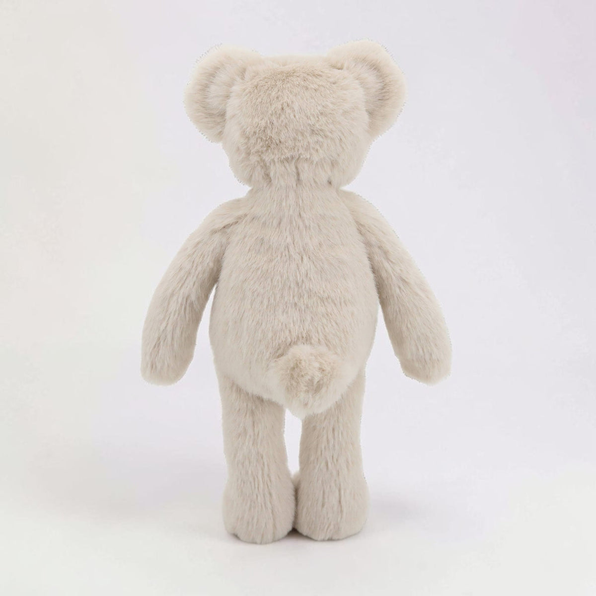 Back view of a Precious Days Gifts Dingle Dangle beige plush teddy bear with a soft textured finish.