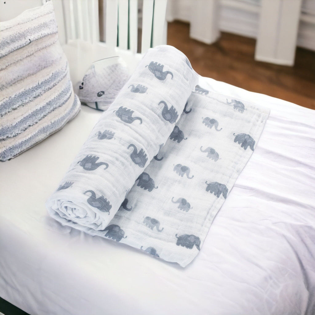 Precious Days Gifts baby muslin blanket with grey elephant print, soft cotton fabric for newborns.