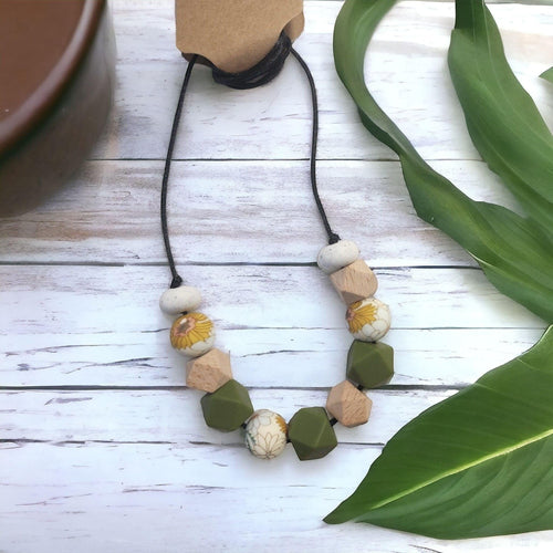 Precious Days Gifts handmade garden-themed teething necklace with silicone, wood, and floral beads.
