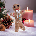 Precious Days Gifts handmade crocheted gingerbread man baby rattle with festive holiday decor and candles