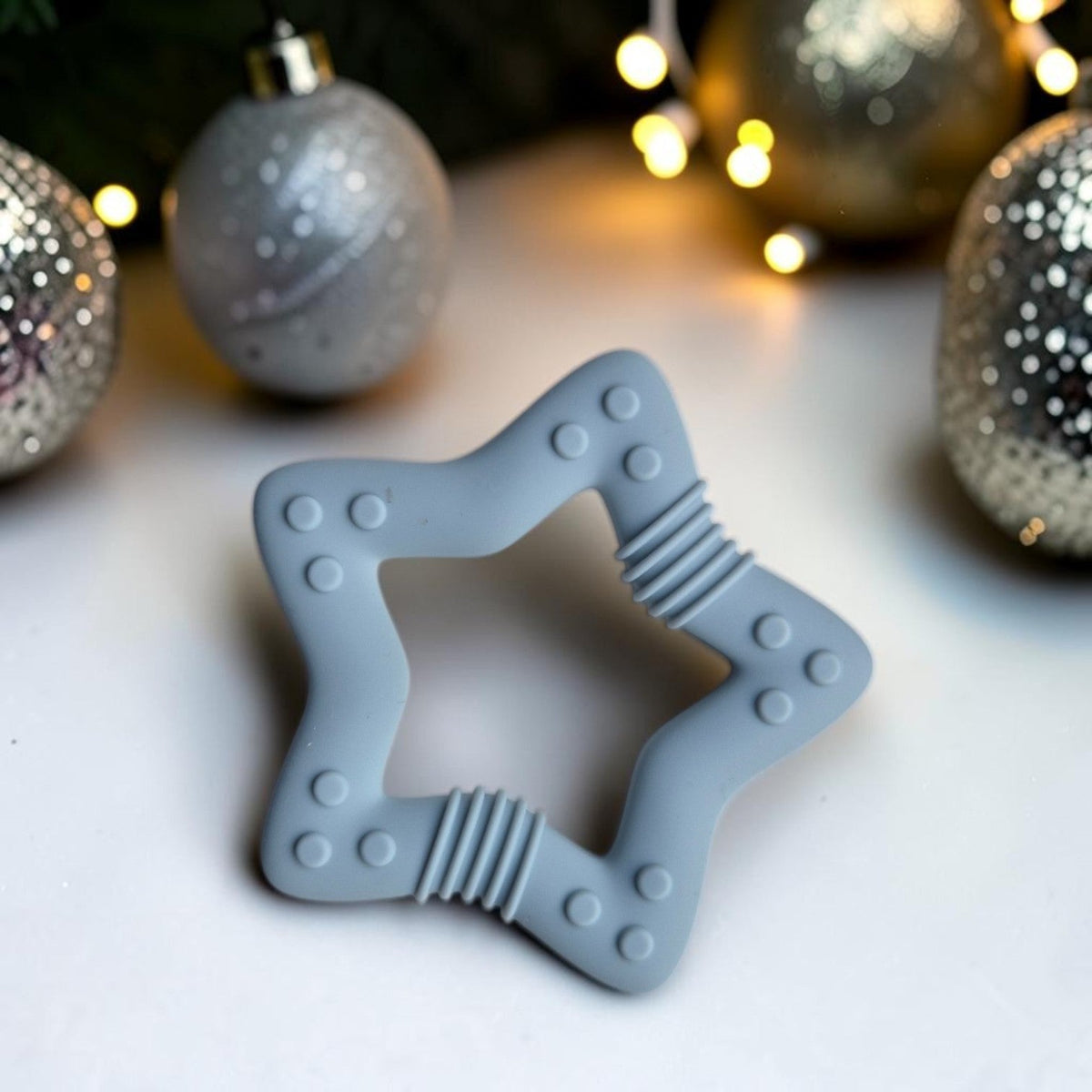 Precious Days Gifts grey silicone star teether with textured surfaces for soothing baby gums during teething