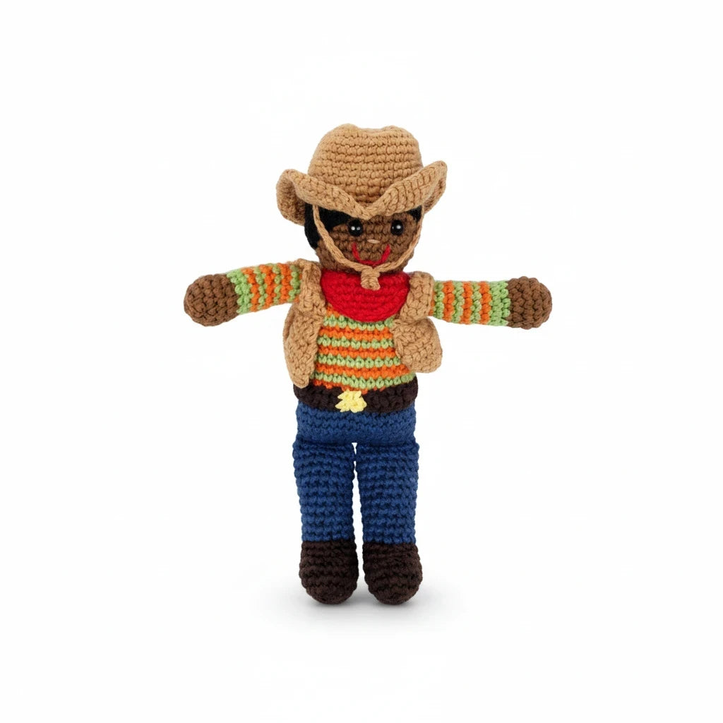 Precious Days Gifts handmade crochet cowboy baby rattle with colourful cotton yarn, brown hat, and blue trousers.
