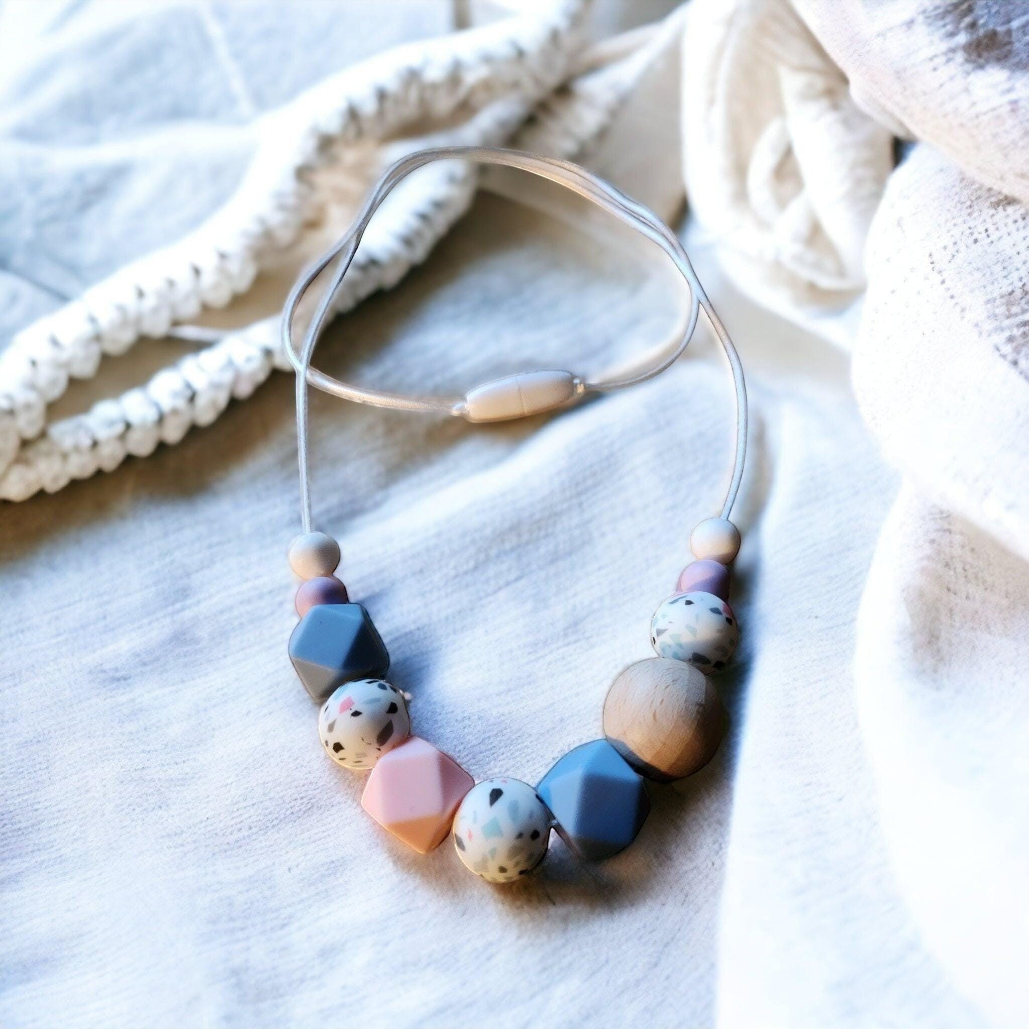 Precious Days Gifts handmade feeding necklace with geometric silicone and wooden beads in soft pastel tones