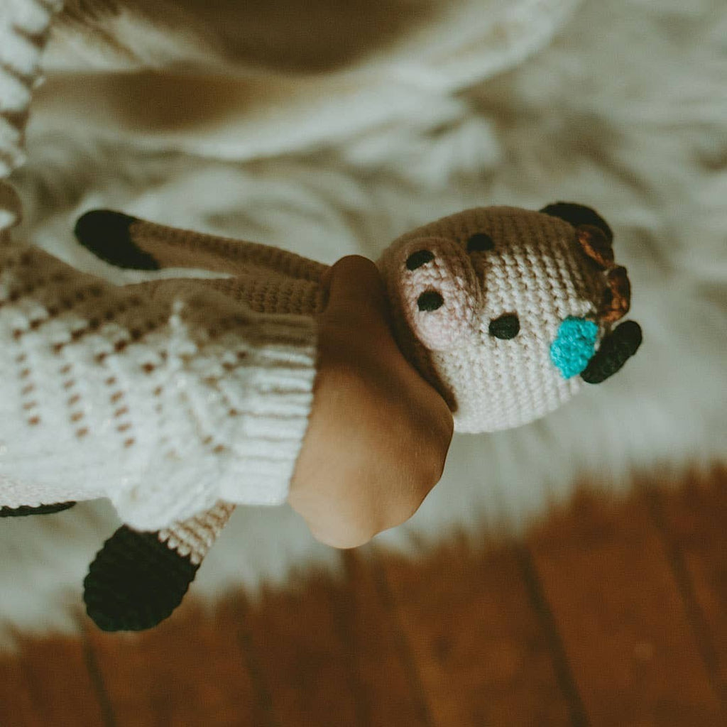 Precious Days Gifts handmade organic cotton plush cow toy with embroidered details and black hooves.