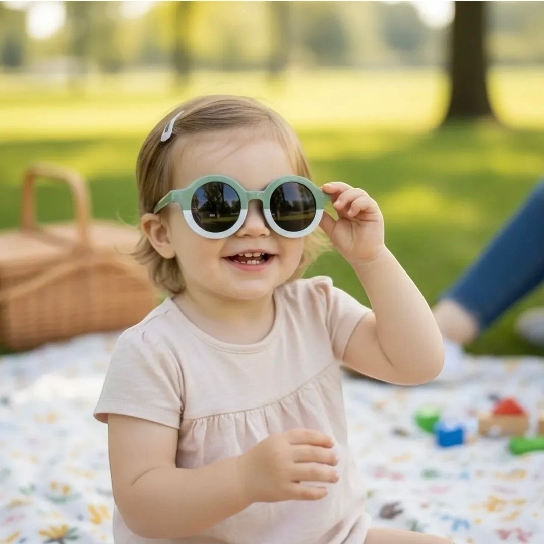 Precious Days Gifts two-tone sage green and white round frame sunglasses for kids with dark lenses.