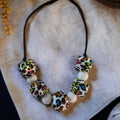 Precious Days Gifts handmade silicone teething necklace with leopard print and white beads. BPA-free, non-toxic.