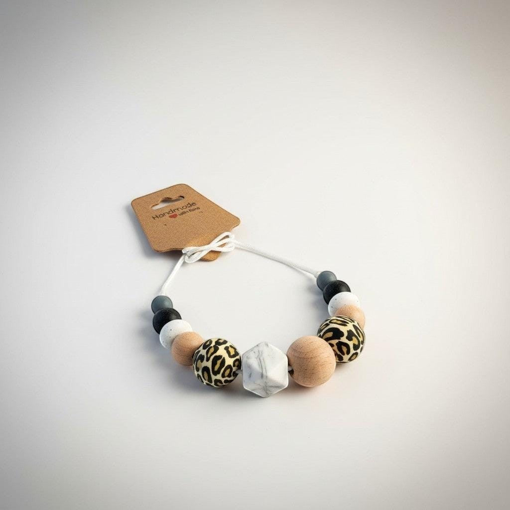 Precious Days Gifts handmade silicone teething necklace with leopard print, wood, marble, and grey beads.