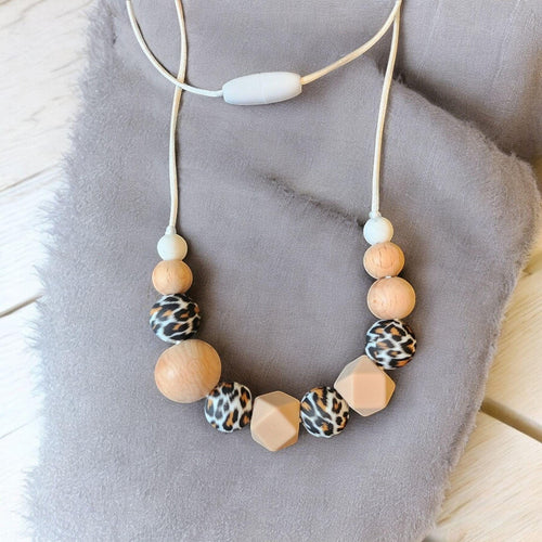 Precious Days Gifts handmade silicone and wood teething necklace with leopard print beads and a safety clasp.