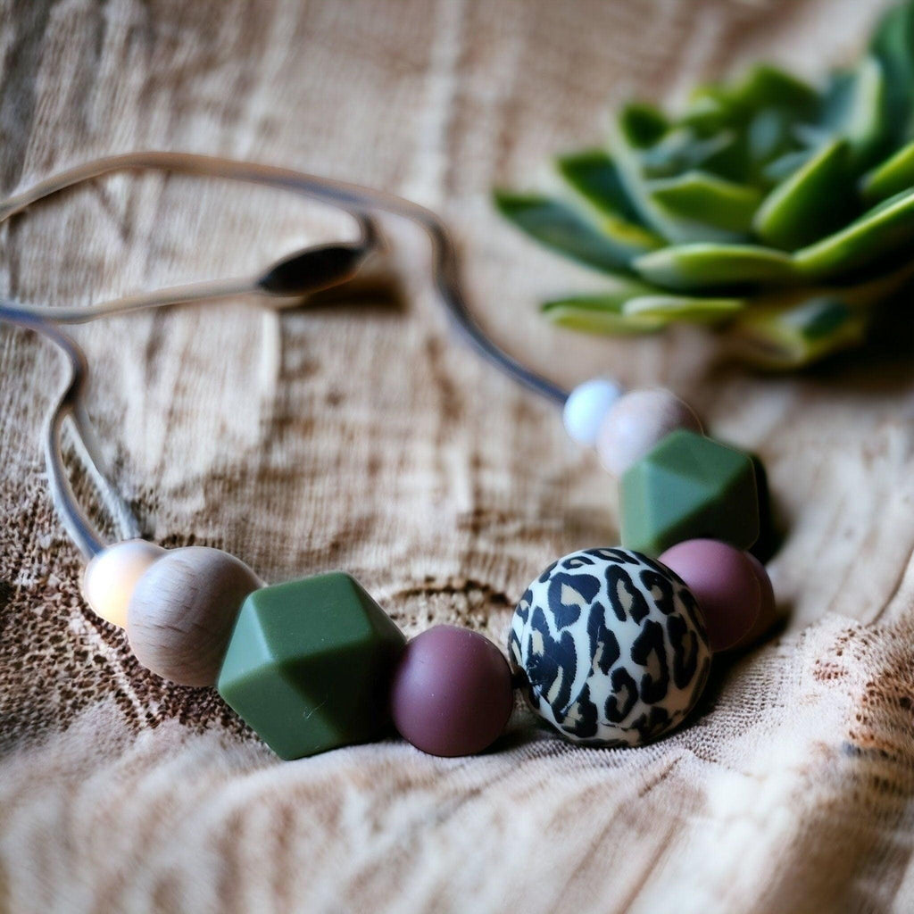 Precious Days Gifts handmade silicone and wood teething necklace with leopard print bead, green and mauve beads.