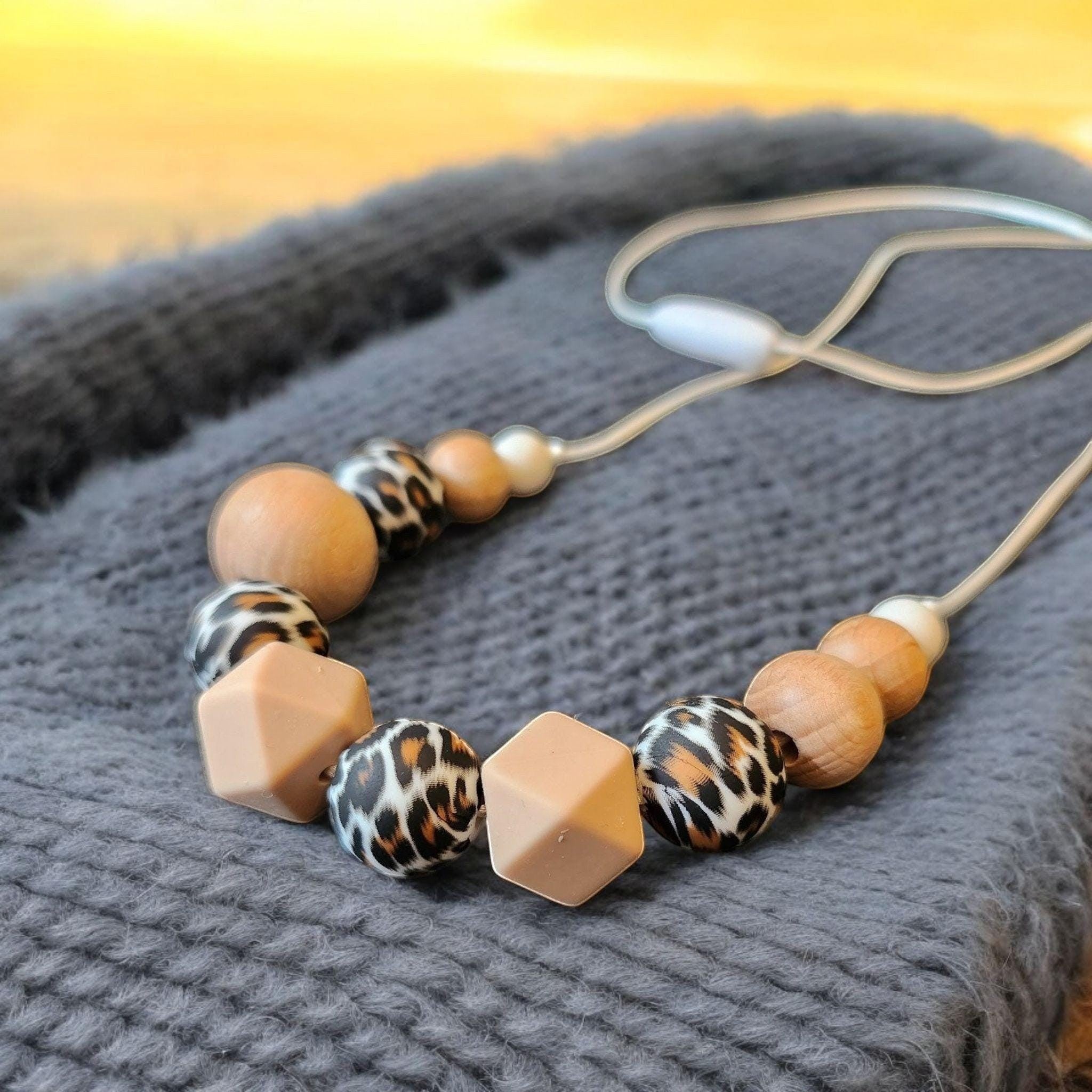 Precious Days Gifts handmade silicone and wood teething necklace with leopard print and geometric beads.
