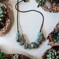 Precious Days Gifts mint marble silicone teething necklace with cube and round beads. BPA-free, food-grade.