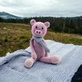 Precious Days Gifts pink knitted pig rattle with blue scarf, suitable from birth.