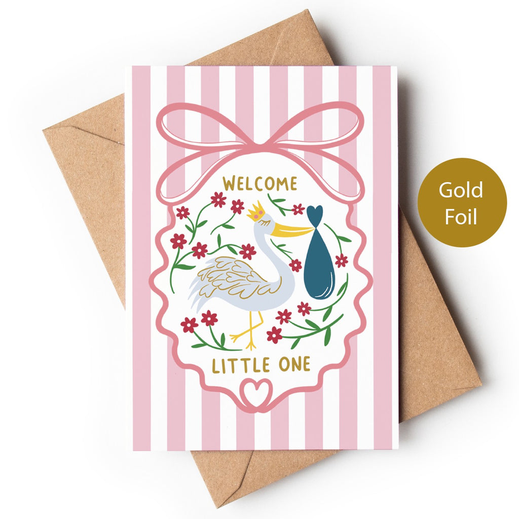 Precious Days Gifts pink striped baby card with stork, flowers, and gold foil "Welcome Little One" text.