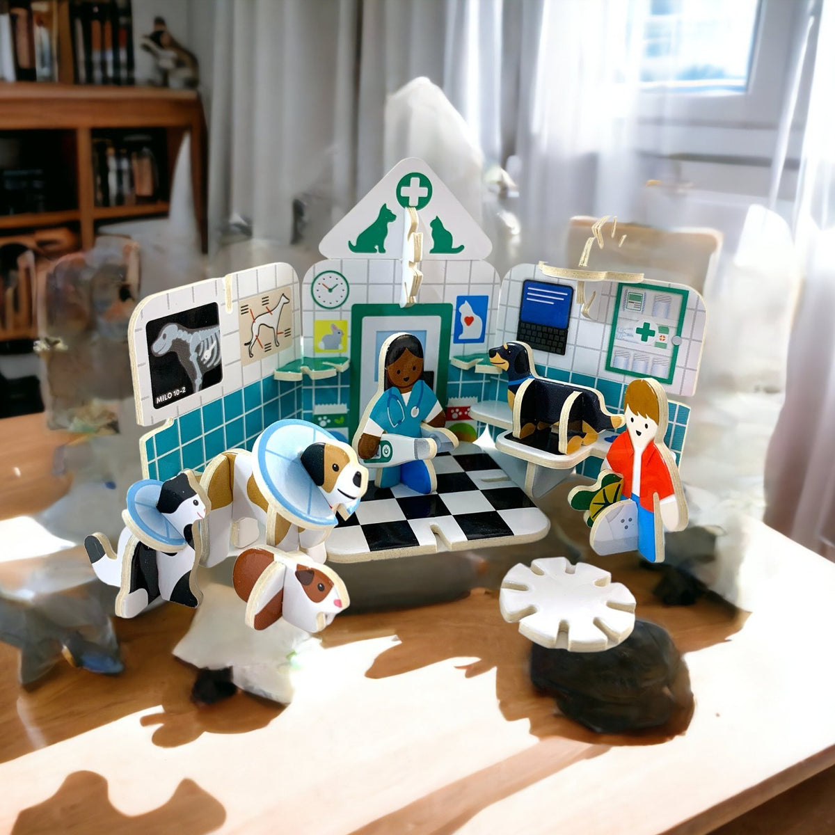 Precious Days Gifts Play Press sustainable cardboard mini vets surgery playset with animal figures and vet characters.