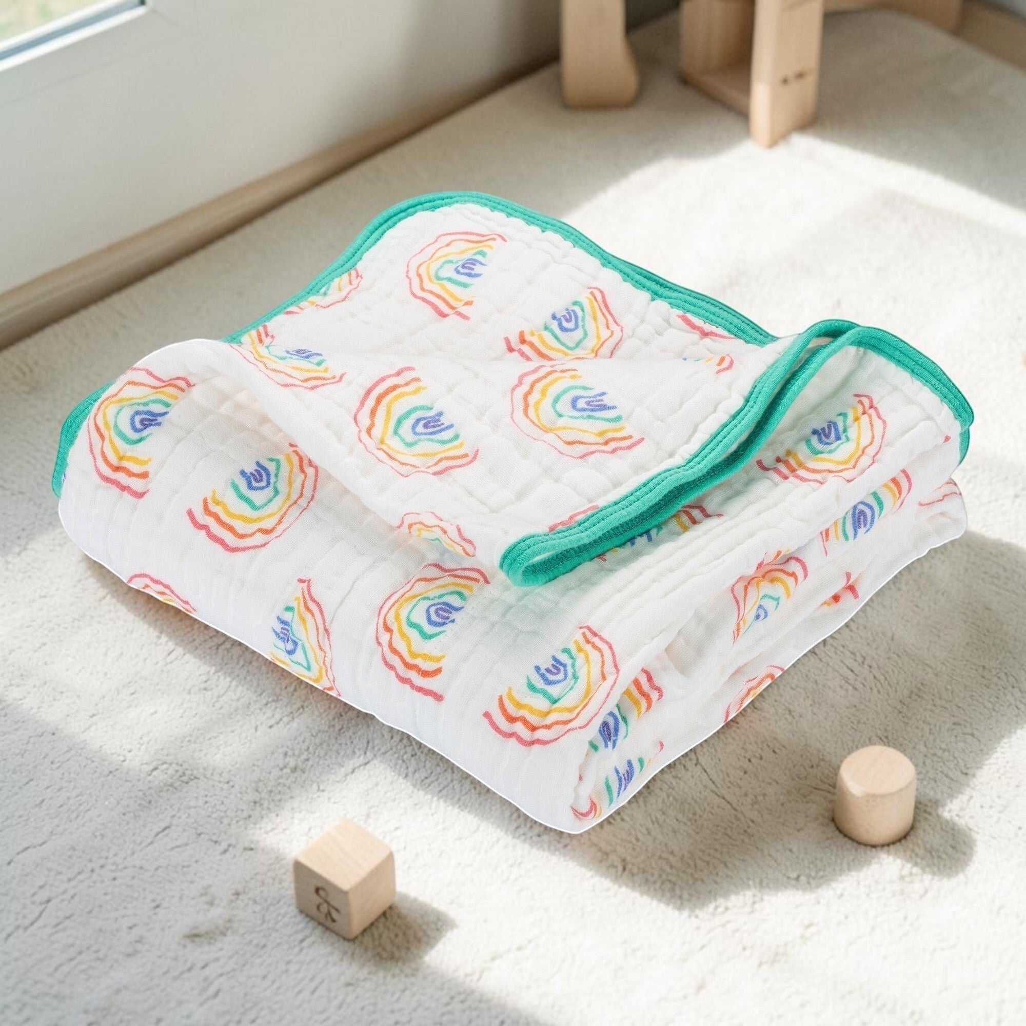 Precious Days Gifts rainbow print 6-layer cotton muslin baby blanket with teal trim