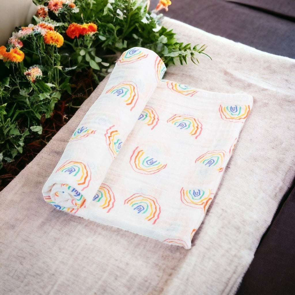 Precious Days Gifts 100% cotton muslin baby swaddle blanket with colorful rainbow print on white fabric