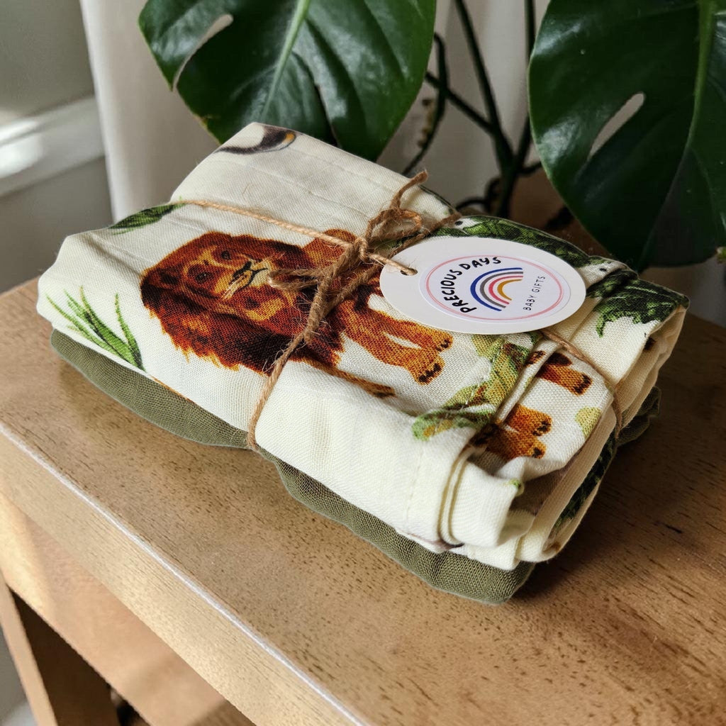 Precious Days Gifts Muslin Duo Gift Set with safari animal print featuring a lion and green accents. 60x60cm.
