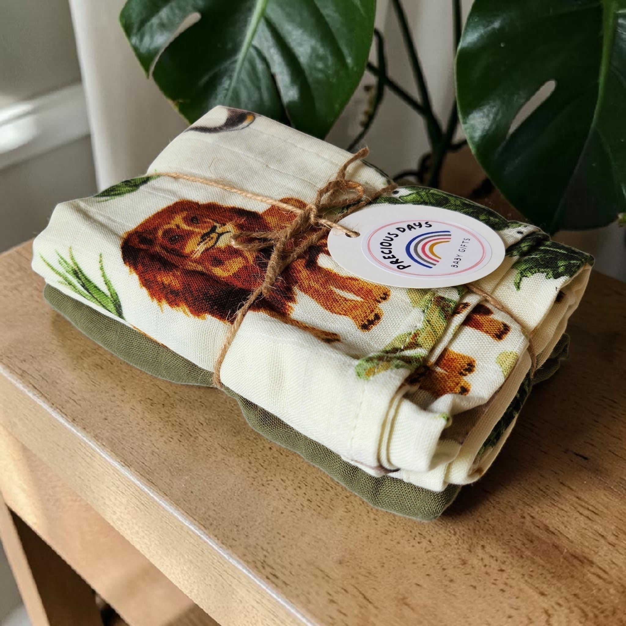 Precious Days Gifts Muslin Duo Gift Set with safari animal print featuring a lion and green accents. 60x60cm.