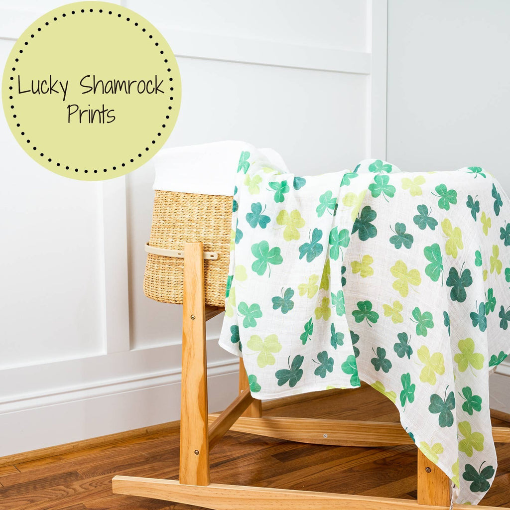 Precious Days Gifts baby muslin swaddle blanket in white with green shamrock print. 100% cotton, 120x120cm.