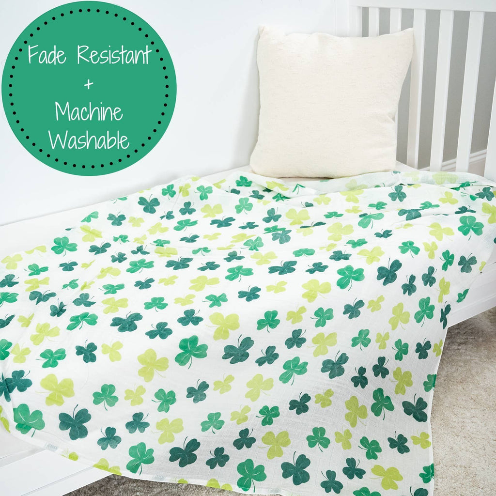 Precious Days Gifts 100% cotton muslin swaddle blanket with a green shamrock print. Fade resistant and machine washable.