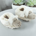 Precious Days Gifts white plush sheep baby slippers, size 0-6 months. Soft, cosy, and machine washable.