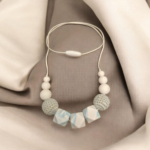 Precious Days Gifts handmade silicone teething necklace with white, grey, and blue marbled beads and a safety clasp.