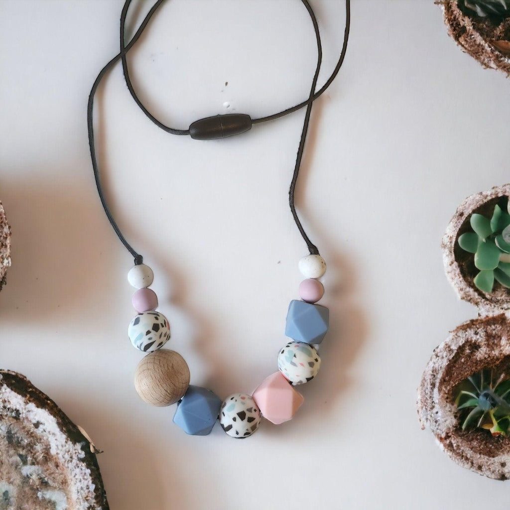 Precious Days Gifts handmade speckled pastel teething necklace with silicone and wood beads.