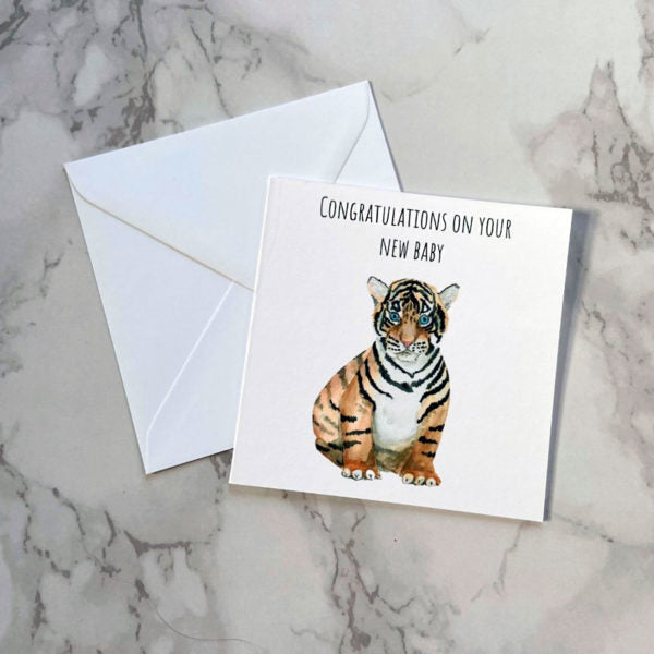 Precious Days Gifts gender neutral new baby card featuring a folk-inspired tiger cub illustration and white envelope.