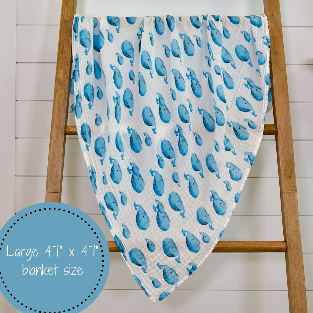 Precious Days Gifts white 100% cotton muslin swaddle blanket with a blue whale print. Large 120x120cm size.