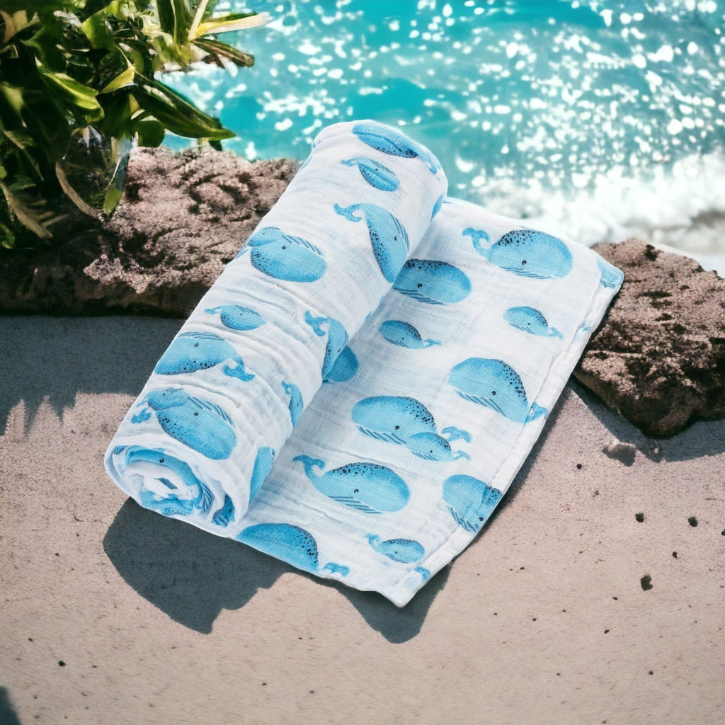Precious Days Gifts white 100% cotton muslin swaddle blanket with blue whale print, 120x120cm.
