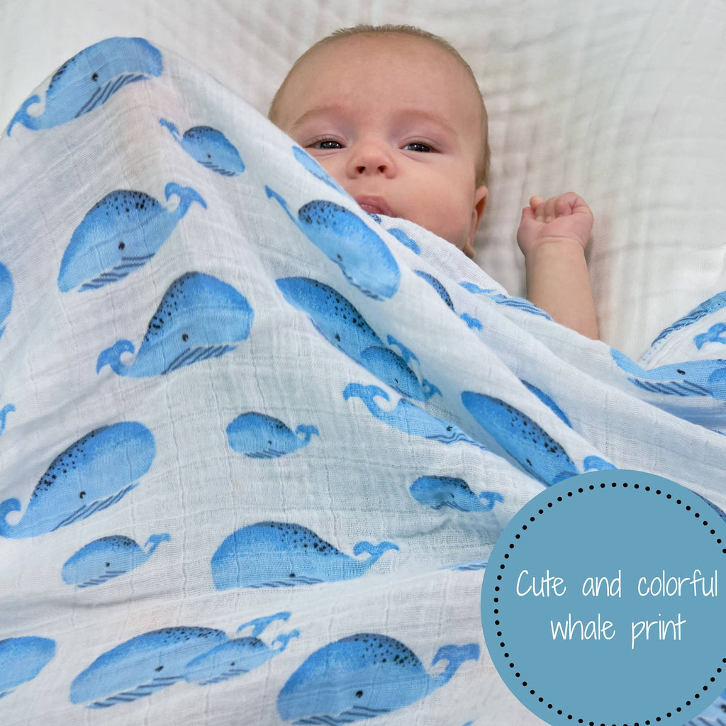 Precious Days Gifts white 100% cotton muslin swaddle blanket with blue whale print. Soft and breathable for babies.